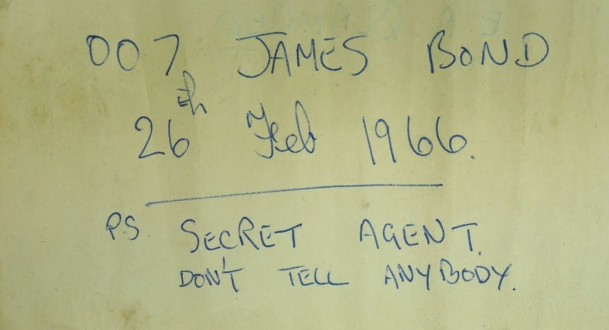 Historic glass bottle with handwritten note from 1966 discovered inside castle fireplace during restoration