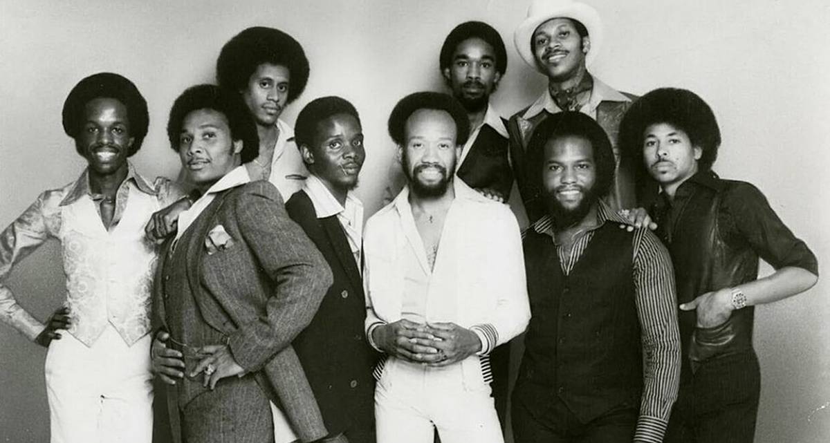 Maurice White of Earth, Wind & Fire performing on stage in celebration