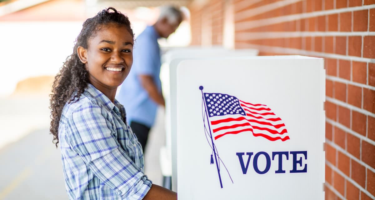 Diverse group of Southern content creators collaborating on voter education materials for local elections