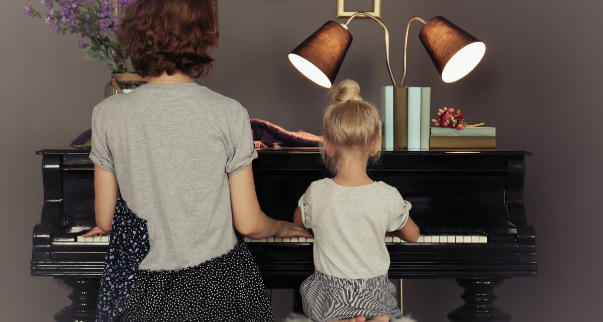 Vintage upright piano in a family living room representing generations of musical heritage