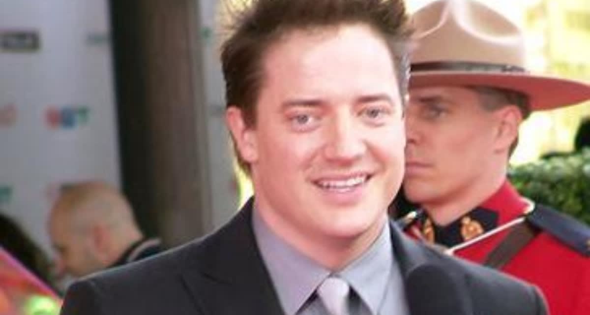 Brendan Fraser helping a fan take a photo at London movie premiere