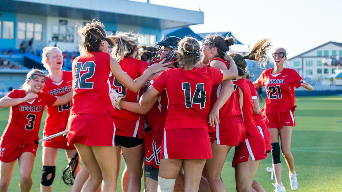 Georgia women's lacrosse team celebrates with championship trophy after defeating Clemson in Naples, Florida