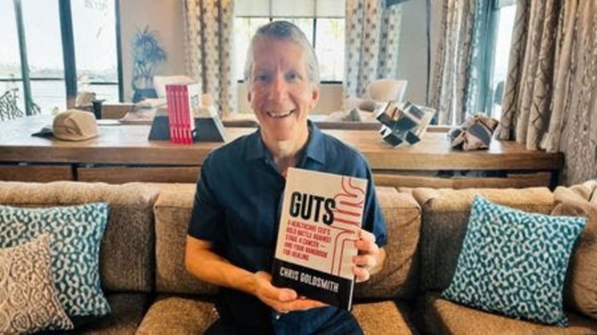 Healthcare executive and cancer survivor Chris Goldsmith smiling, author of GUTS survival guide
