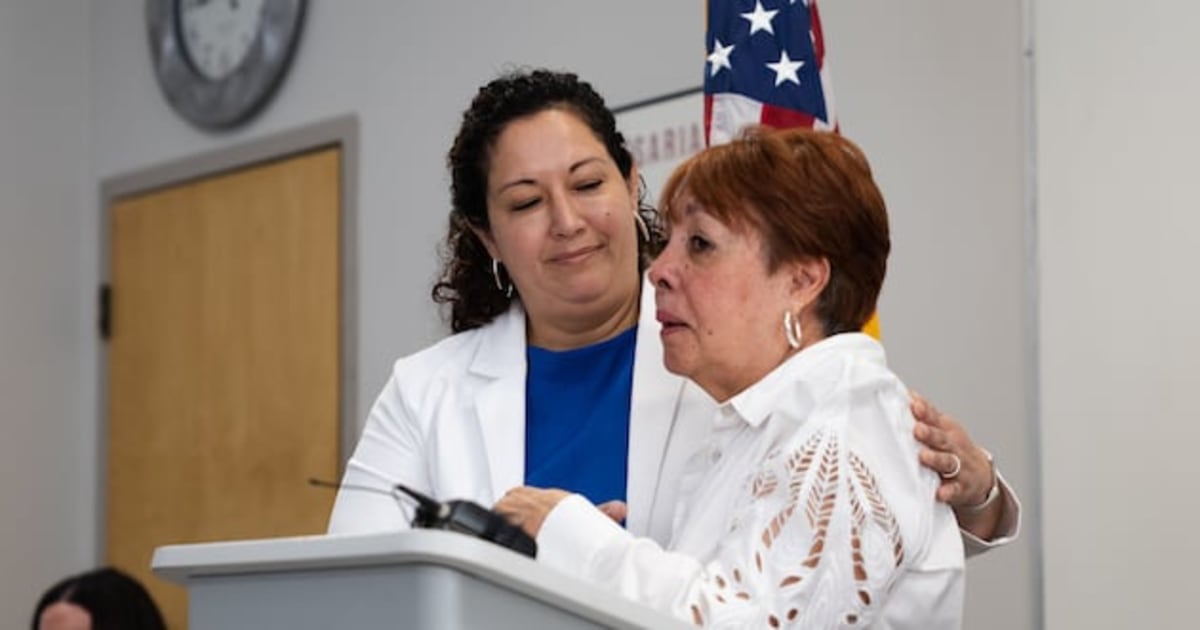 Gladys Gonzalez hugging Suazo Business Center CEO Sylvia Castro at press conference