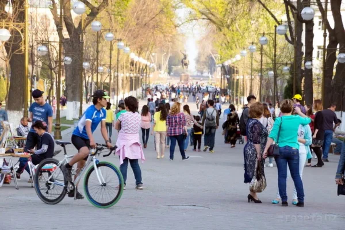 Families gathering in Uzbekistan community celebrating economic progress and poverty reduction achievements