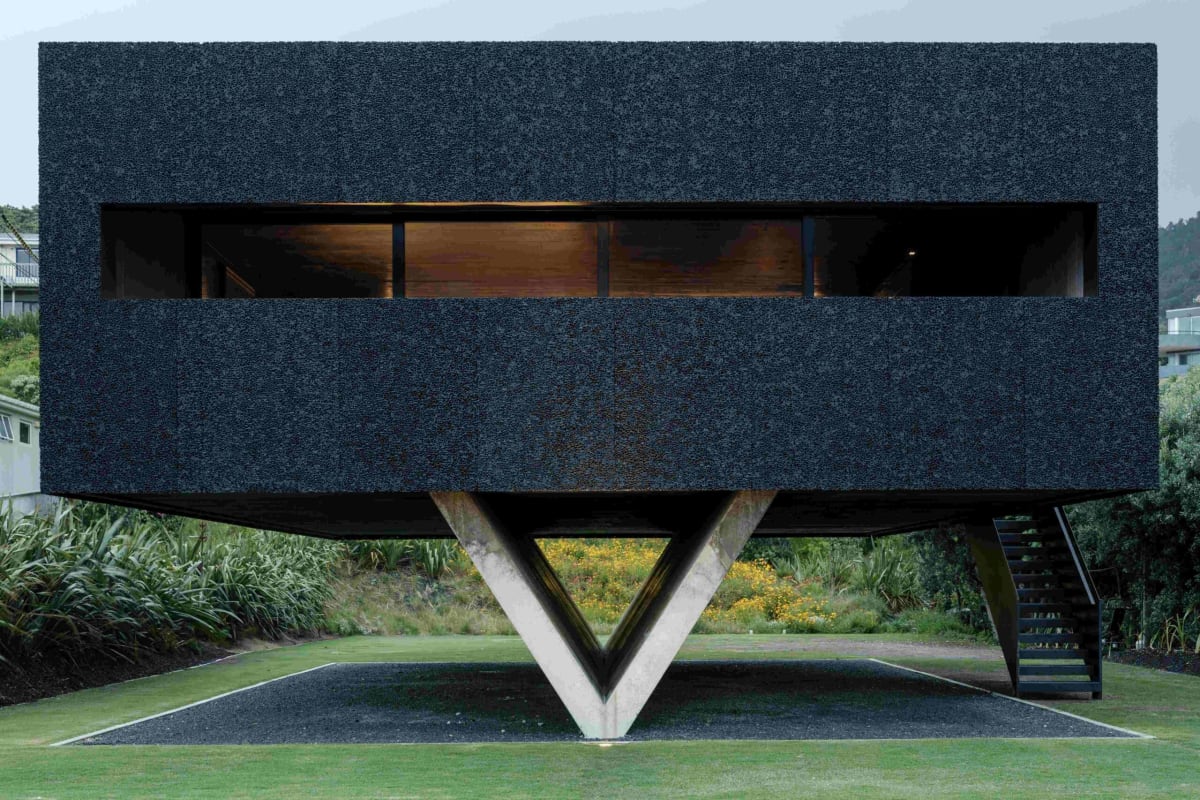 Award-winning Bunker House beach home in Piha designed by Chris Tate featuring bold modern architecture