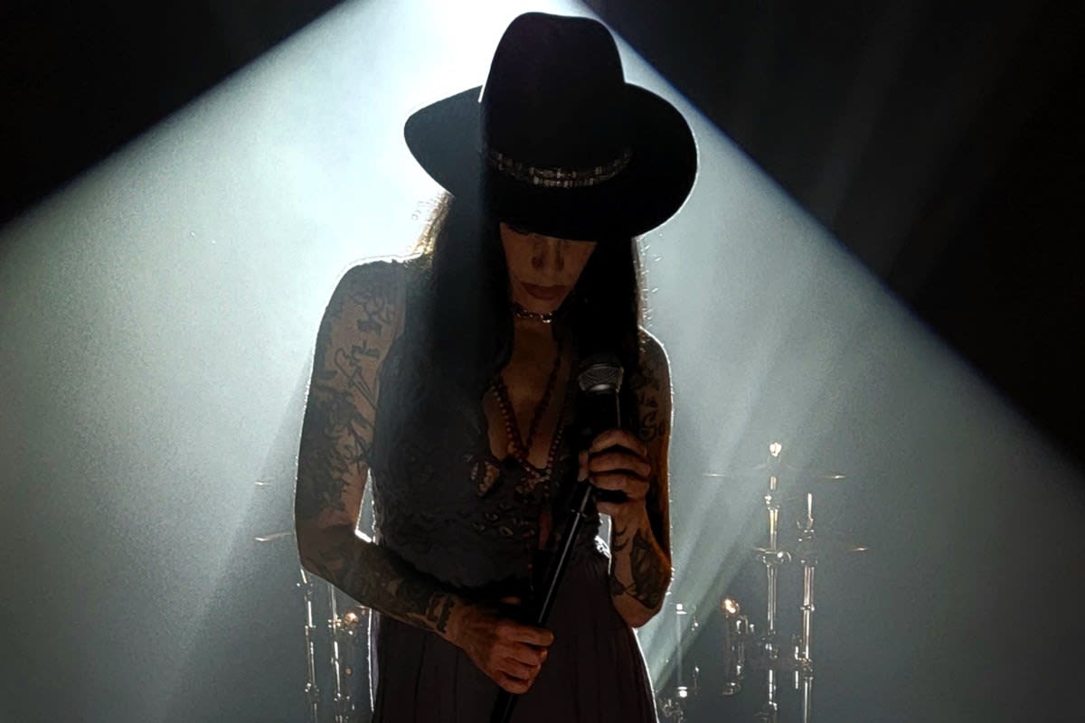 Canadian rock musician Bif Naked performing on stage, a breast cancer survivor supporting Gilda's Club