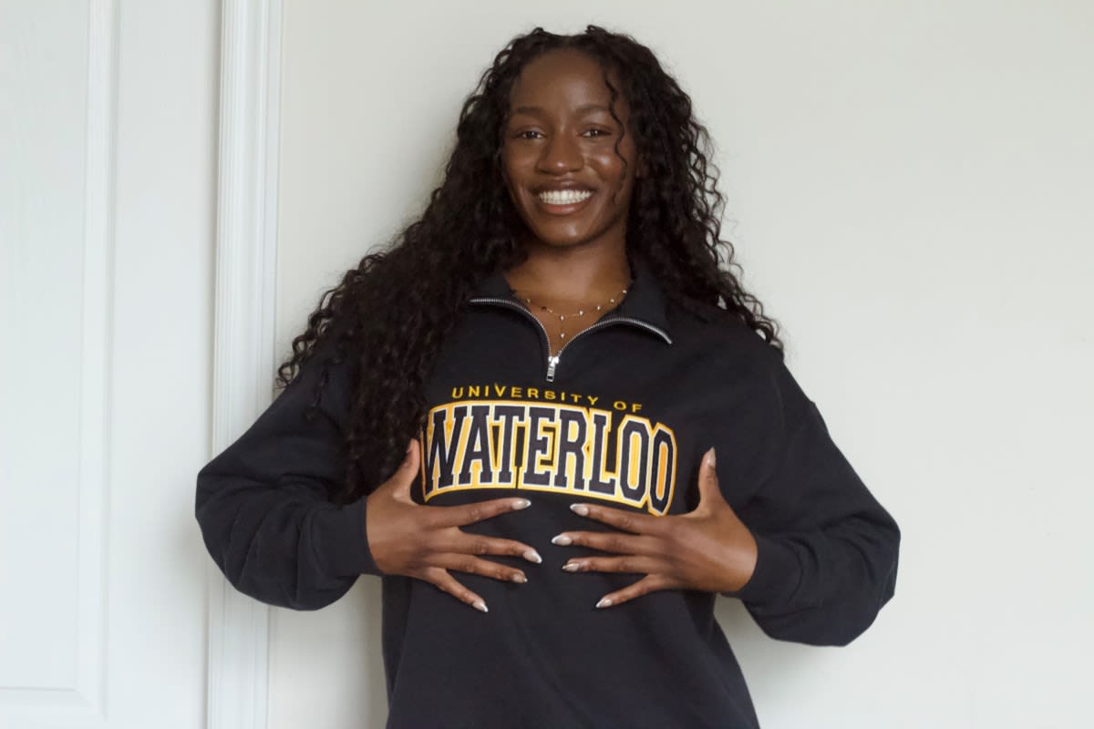Young woman in graduation attire smiling, representing teen scholarship winner Onna Okeke