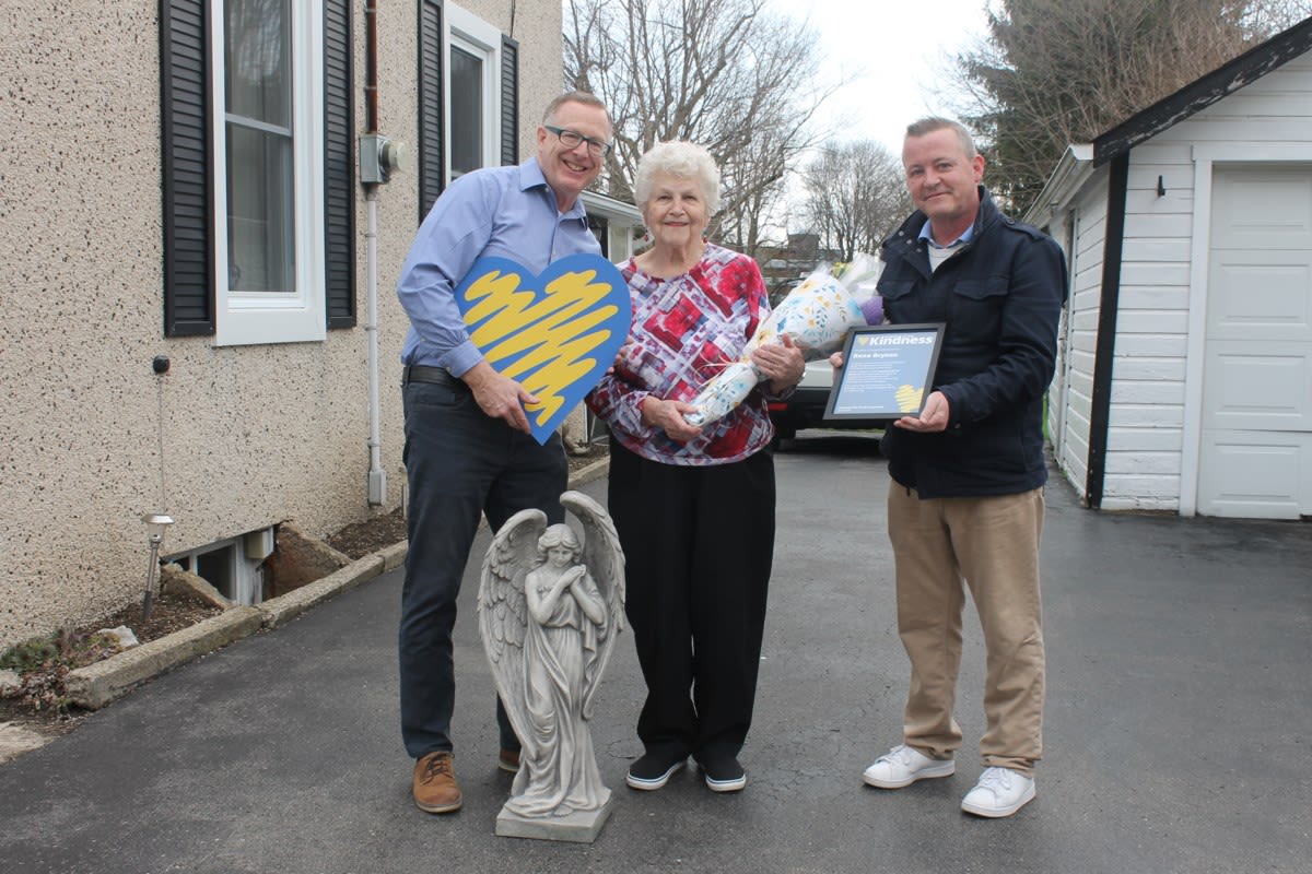 Ninety-year-old woman Rena Bryson smiling while being honored for lifetime of community kindness