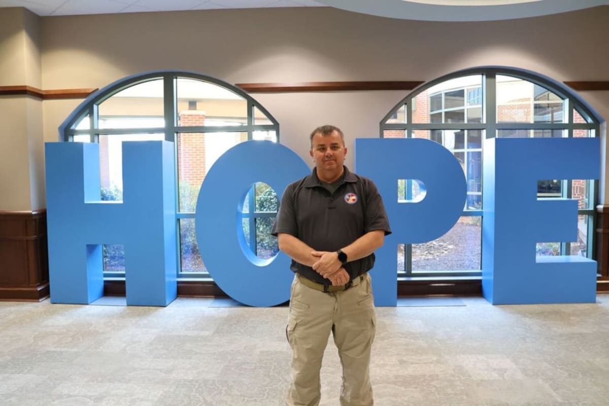 Firefighter Calvin Otis Hitchcock in uniform smiling after beating lymphoma with proper treatment
