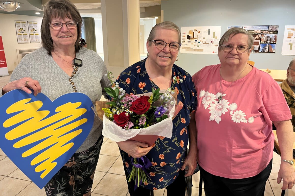 Diane Labelle receiving flowers and gift cards at Pioneer Manor in Sudbury Ontario