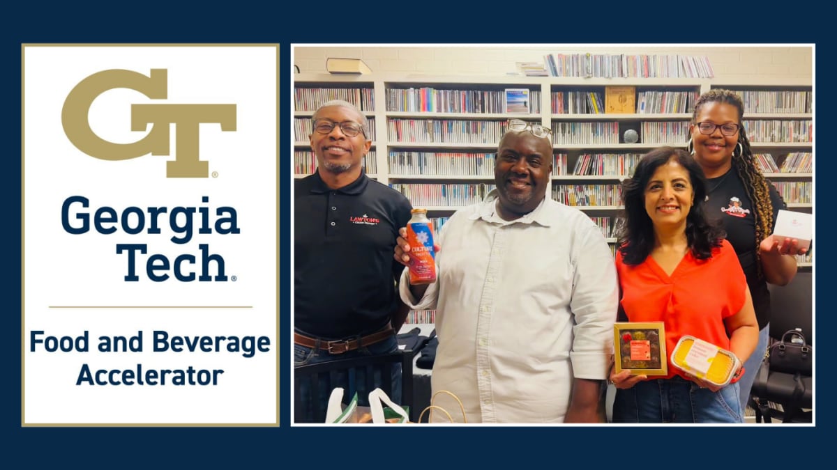 Four food entrepreneurs standing together discussing their success at Georgia Tech accelerator program