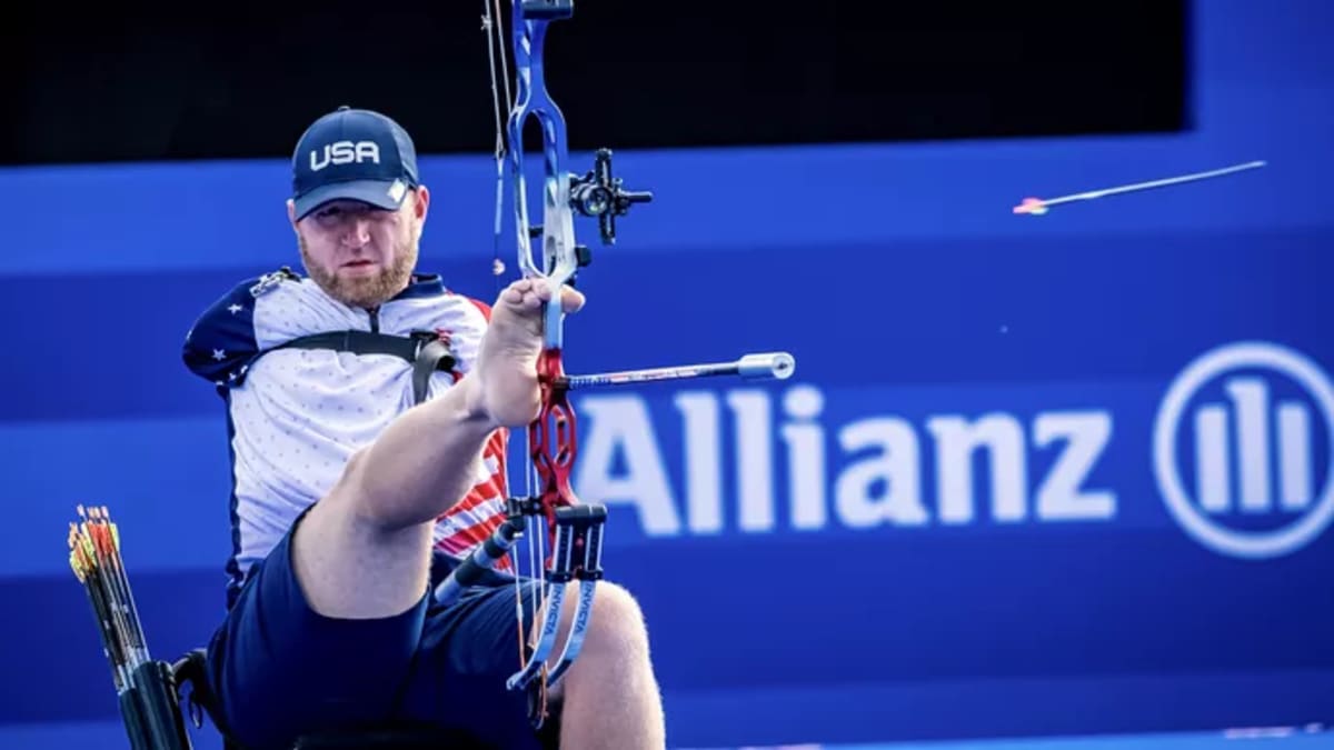 Matt Stutzman competing in archery, drawing bow with his feet and shoulder