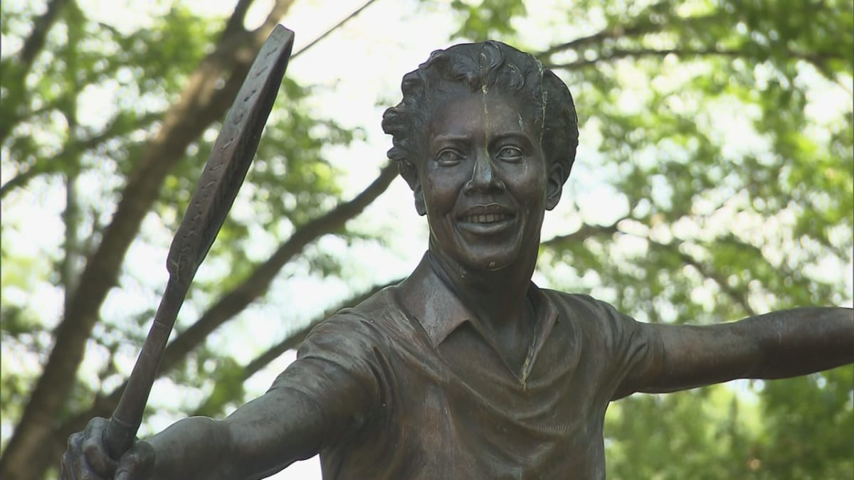 Althea Gibson holding tennis racket in historic Wimbledon championship victory photograph
