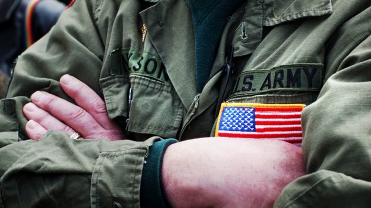 Military veteran receiving supervised psychedelic therapy treatment in clinical setting for PTSD relief