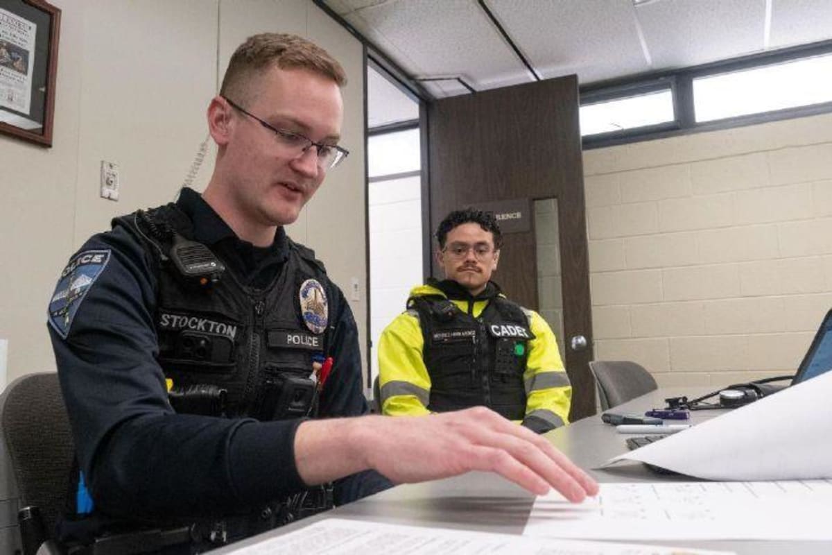 Police officer administering field sobriety test to volunteer during cannabis impairment training session