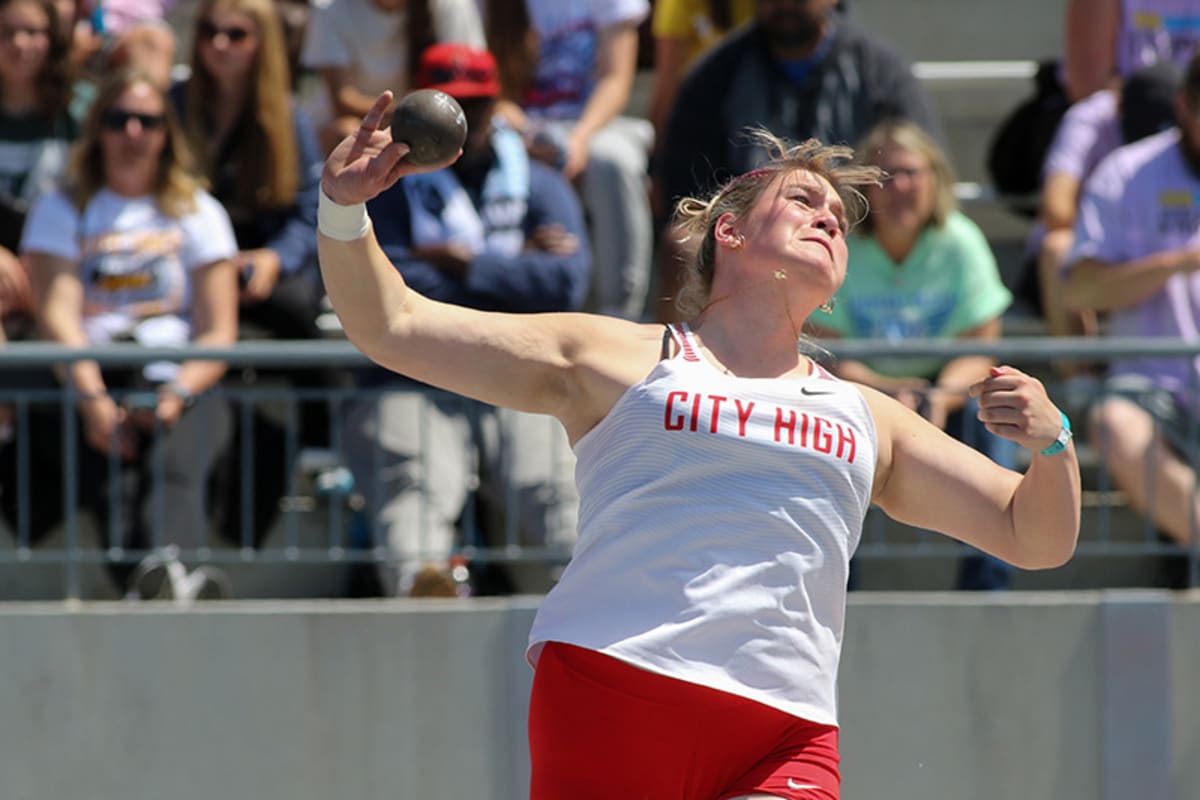 High school senior Rachel Haack celebrates after record-breaking shot put throw at track meet