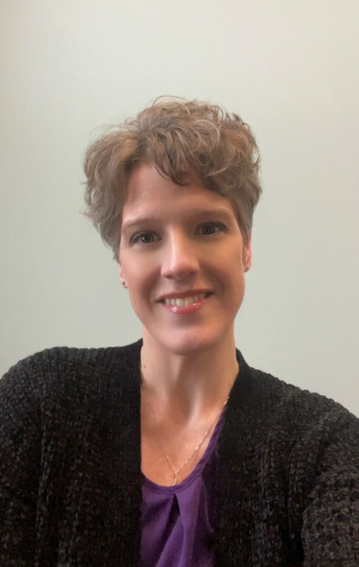 ** Cancer survivors Stephanie Huppert and Tommy Helmer smiling, preparing to speak at community Relay event