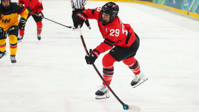 Marie-Philip Poulin celebrates in red Team Canada jersey during Olympic hockey quarterfinal game