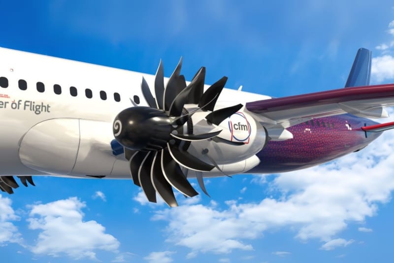 Open fan aircraft engine with exposed rotating blades being tested at modern airport facility