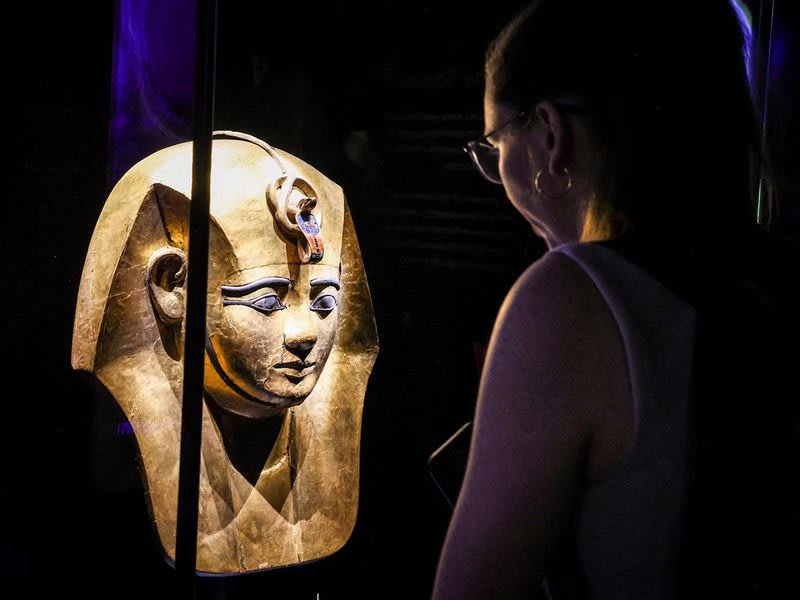 Golden sarcophagus and ancient Egyptian artifacts displayed at London's Battersea Power Station exhibition