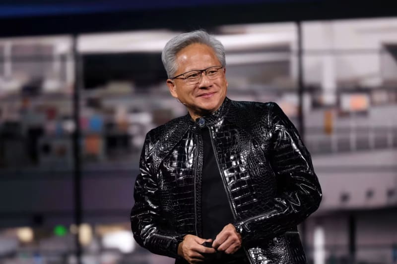 Nvidia CEO Jensen Huang presenting new AI computing technology at CES conference in Las Vegas