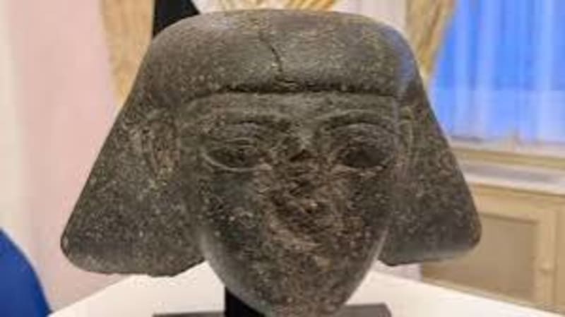 Ancient Egyptian stone head artifact from King Thutmose III era being officially returned to Egypt