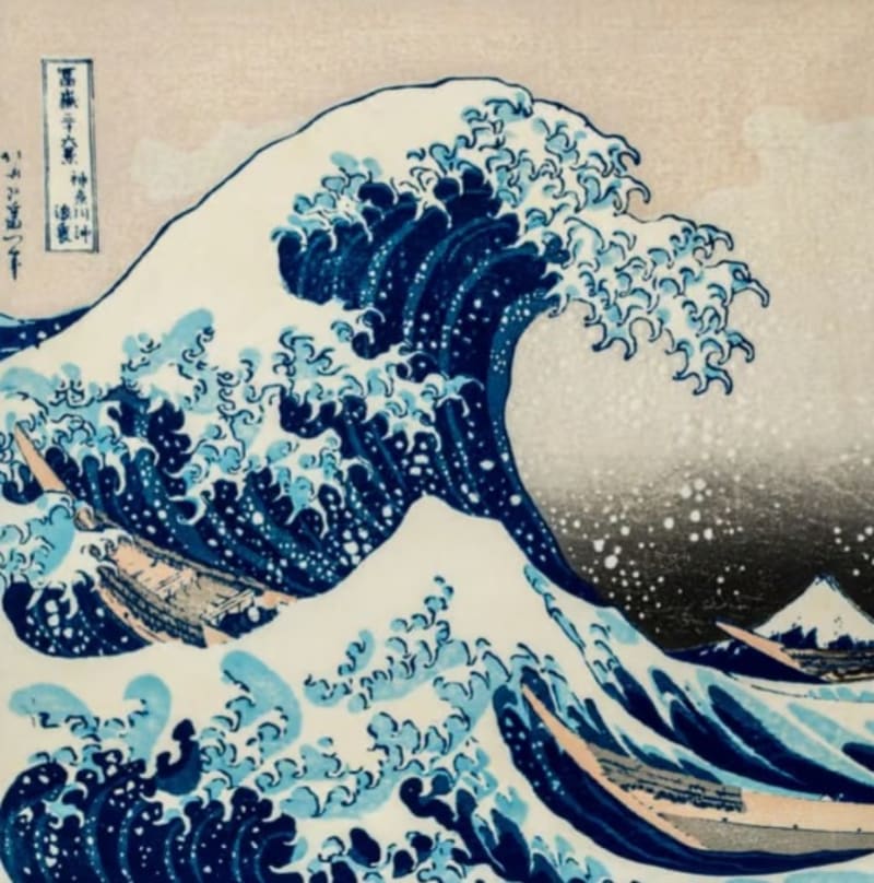 Visitors viewing colorful Japanese woodblock prints displayed on gallery walls at Shasta College exhibition