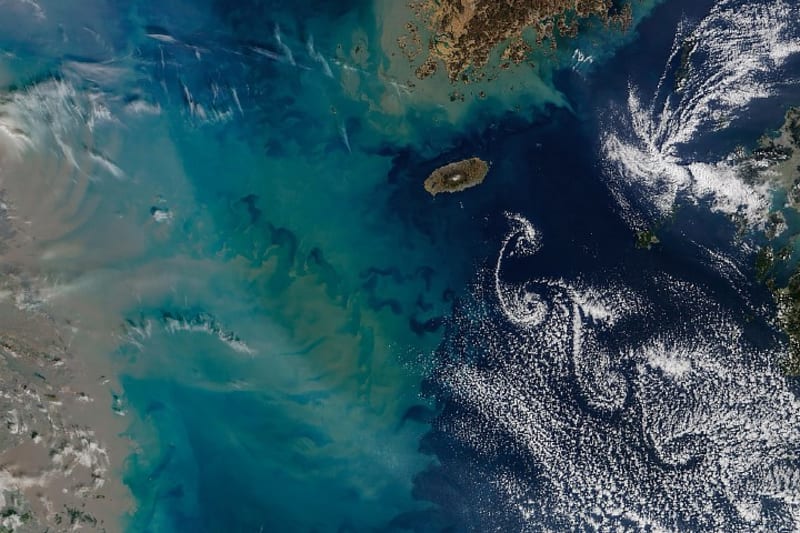 Nature's Art: Clouds Spiral Behind South Korea's Jeju Island