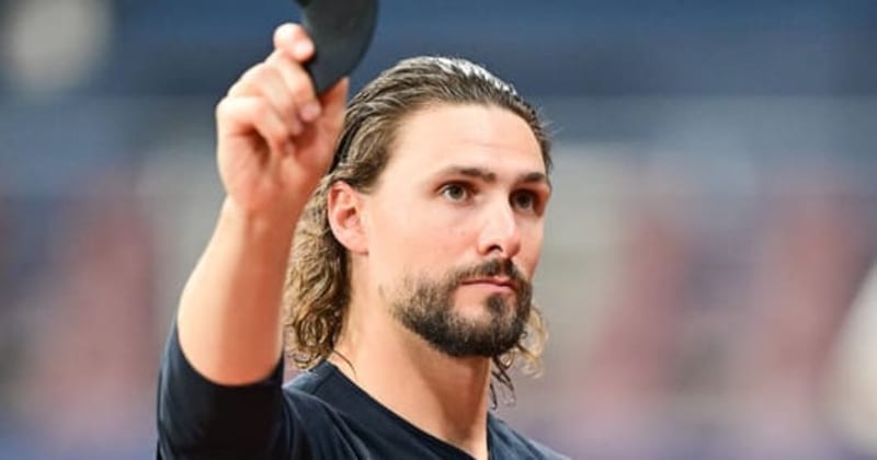 Baseball pitcher Ryan Weiss in Houston Astros uniform smiling after signing major league contract
