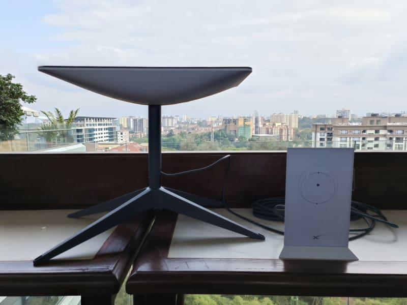 Starlink satellite dish installed on Nigerian building rooftop overlooking Lagos cityscape