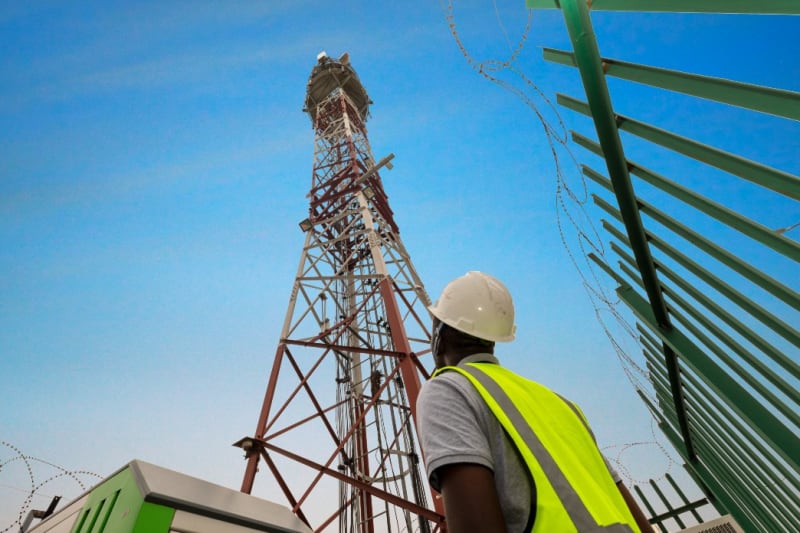 Modern telecommunications tower against blue sky in Lagos, Nigeria, representing network infrastructure investment
