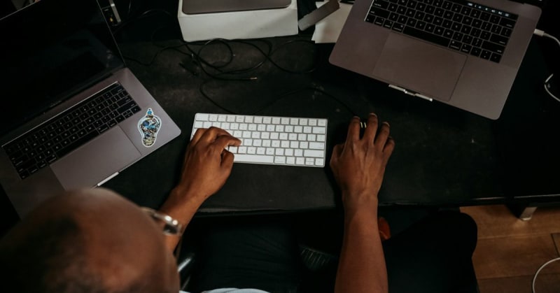 African business owner using smartphone to query company data in local language