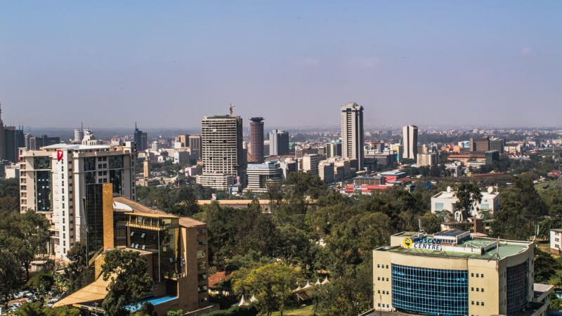 Aerial view of modern technology buildings and infrastructure in Kenya's emerging innovation cities with green landscapes