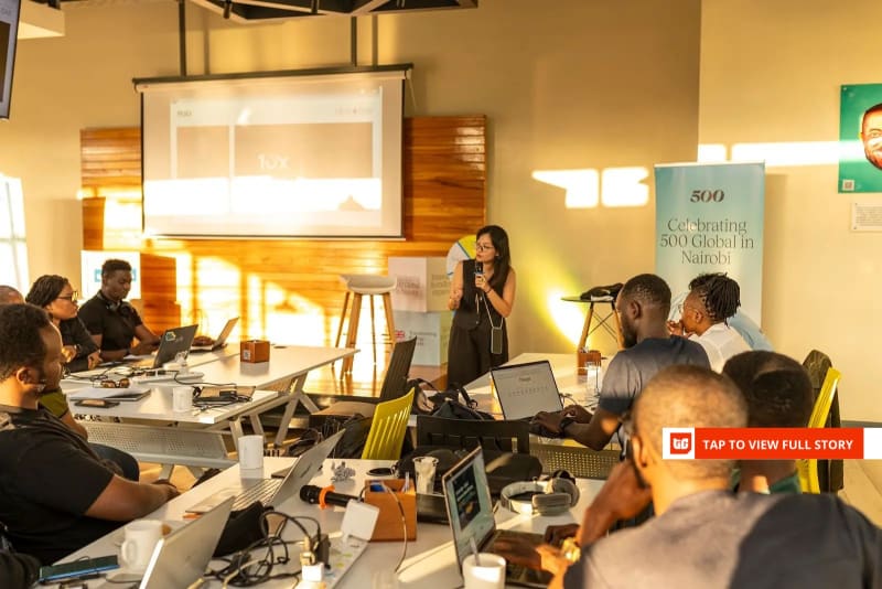 African entrepreneurs collaborating on sustainable technology solutions in modern innovation workspace