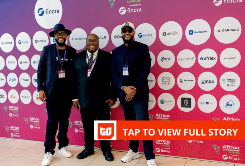 Kenyan family reviewing financial documents with mobile phone showing money transfer app