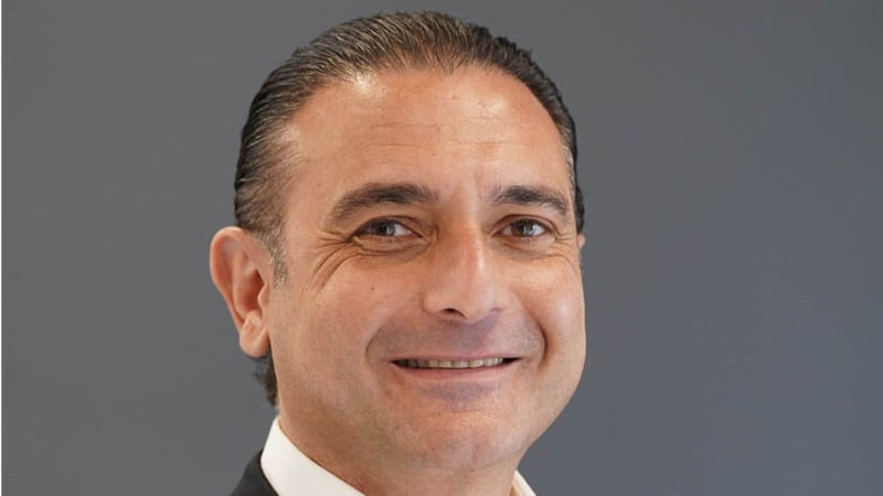 Mobile phone tower with digital network connections across African landscape showing AI network optimization technology