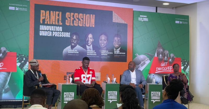 Tech entrepreneurs and policymakers in discussion at Lagos townhall event addressing innovation and regulation