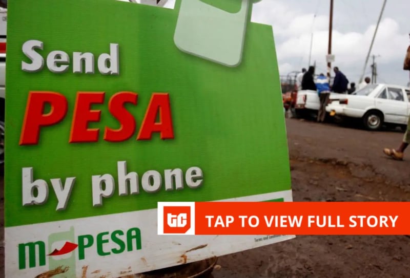 Person using mobile phone to make secure M-Pesa payment transaction in Kenya