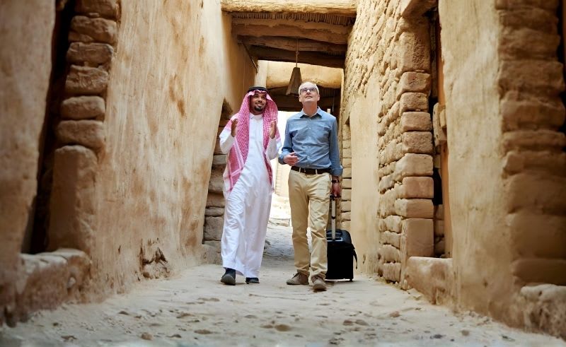 Tourists exploring historic sites and natural landscapes across Saudi Arabia's growing tourism destinations