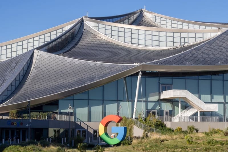 Aerial view of solar panels and wind turbines generating clean renewable energy for power grid