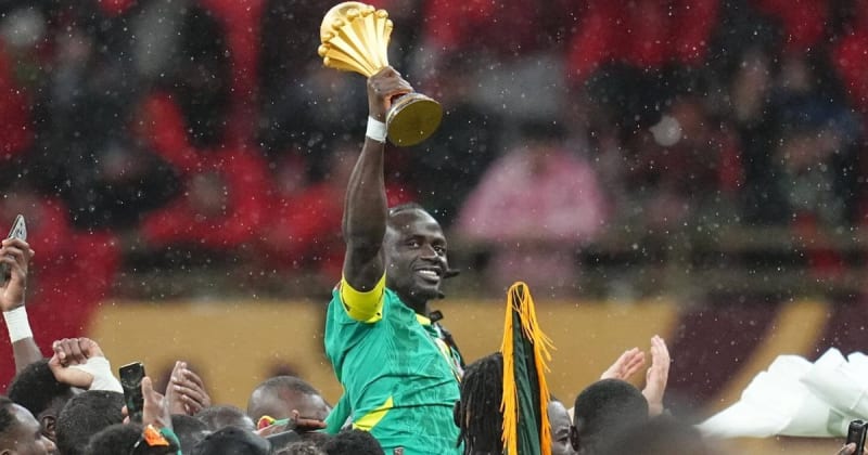 Senegal national football team players celebrating with AFCON trophy after defeating Morocco in final