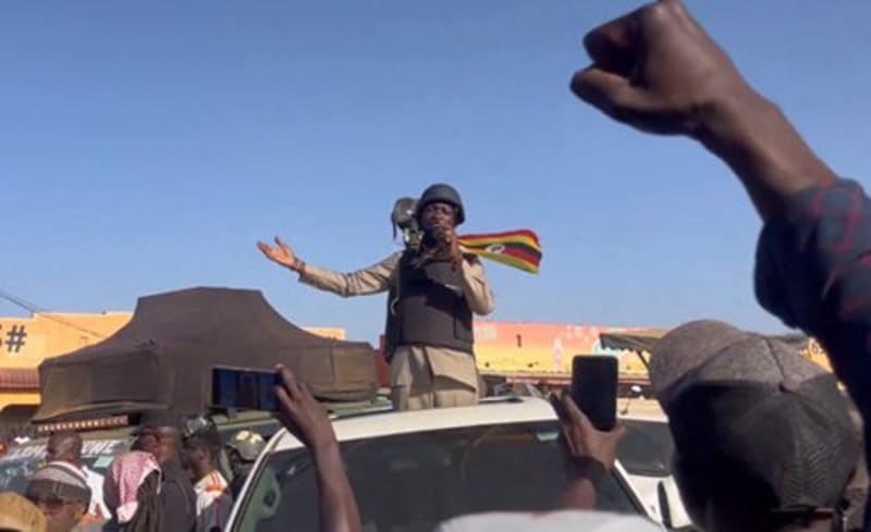Bobi Wine greeting enthusiastic supporters during campaign rally in Uganda's Karamoja region, showing democratic engagement and hope