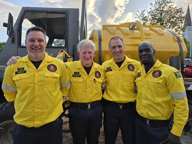 Greyton volunteer firefighters standing with their community-funded Unimog fire truck in South Africa