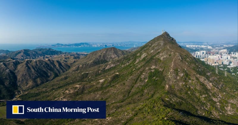 Helicopter rescue operation over steep cliff terrain in Hong Kong mountains