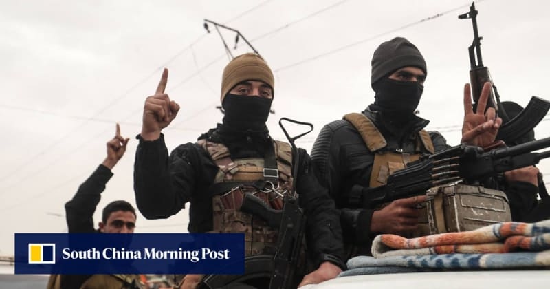 Syrian military forces standing at attention at Al-Tanf base in desert landscape