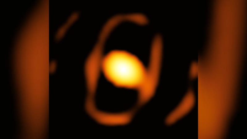 Artistic rendering of massive red supergiant star WOH G64 surrounded by egg-shaped gas cocoon