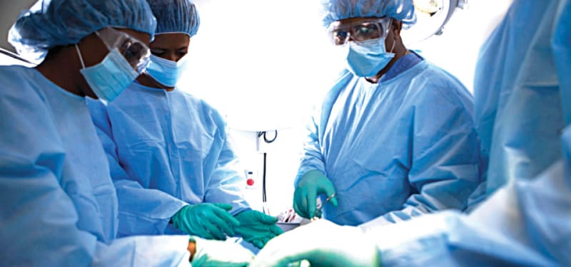 ** Nigerian healthcare workers in a federal hospital facility providing patient care services