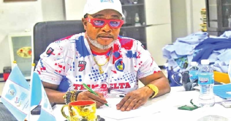 Nigerian athletes training on outdoor track with federation officials reviewing digital registration platform