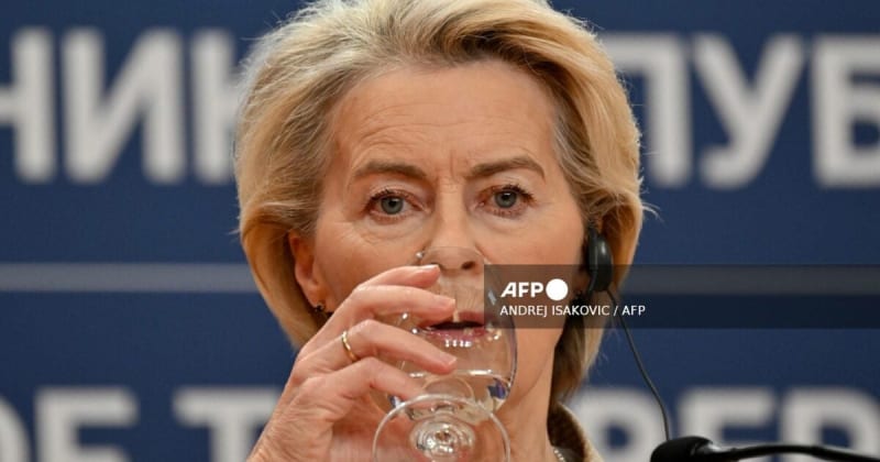 European Union flags waving outside Commission building representing international financial cooperation